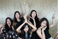 Guests posing with props in an event photo booth print